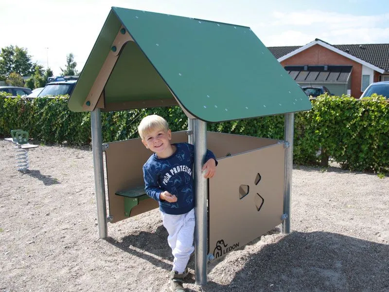 Playhouse Beth on a playground with child Playhouse Beth on a playground with child